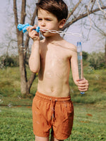 KIDS SWIM SHORTS IN COPPER